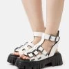 Buffalo VEGAN LION TEETH - Plateausandalette - White